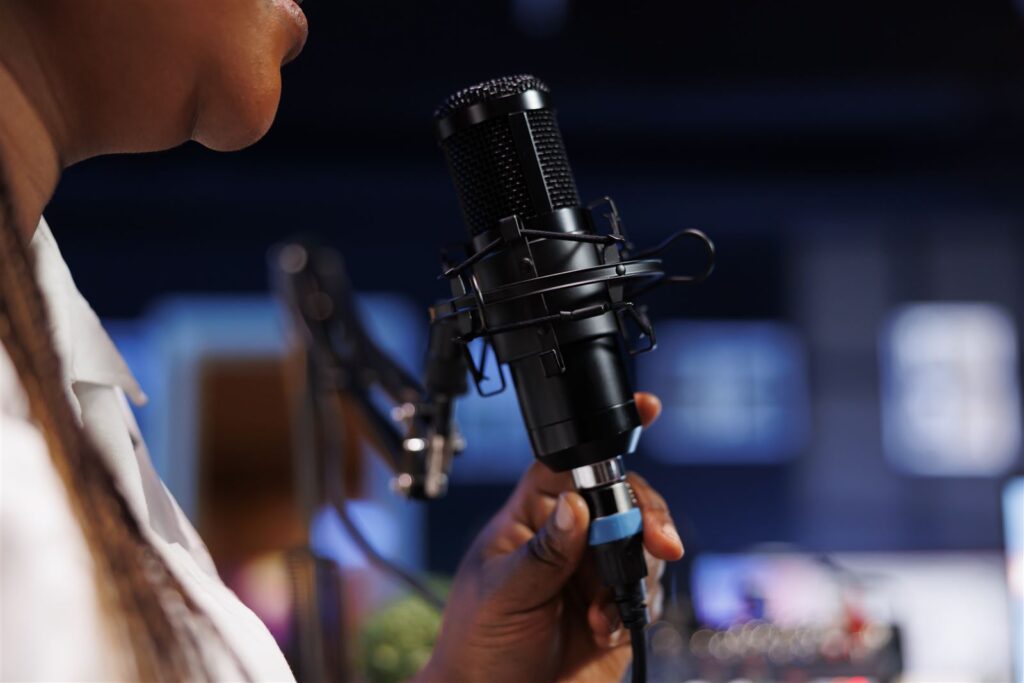 Woman recording a podcast with a professional microphone